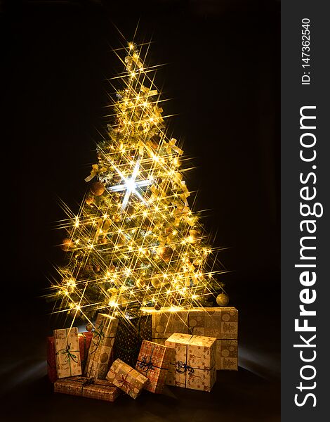 Golden Christmas tree bokeh in a black background
