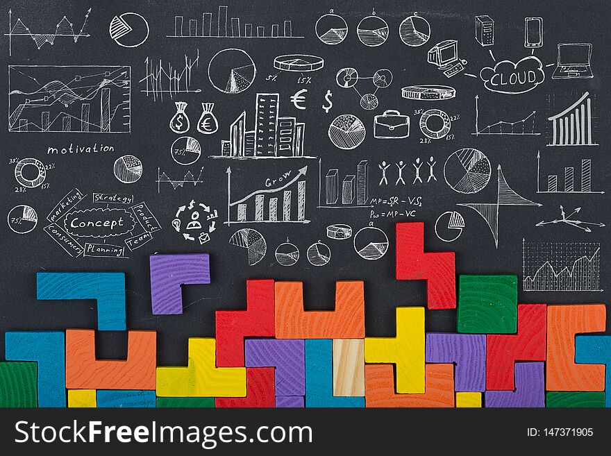 Business concept - jigsaw, sketch with schemes and graphs on chalkboard. Business concept - jigsaw, sketch with schemes and graphs on chalkboard