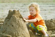 Girl Playing With Wet Sand Stock Photos Girl Playing With Wet Sand Stock Photos