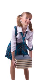 Schoolgirl Is Holding The Stack Of Book. Stock Photo Schoolgirl Is Holding The Stack Of Book. Stock Photo
