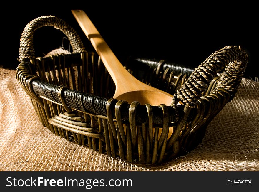 Still life: basket and wooden spoon