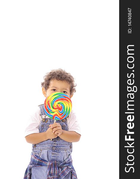 Shot of a toddler peeking behind lollipop