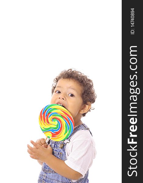 Shot of a child eating a big lollipop