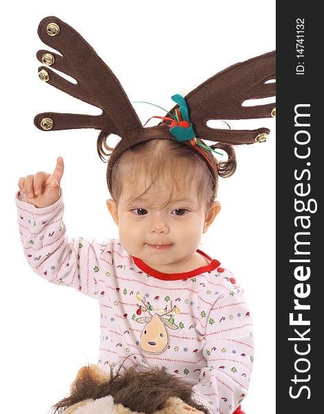 Baby on pony with reindeer ears