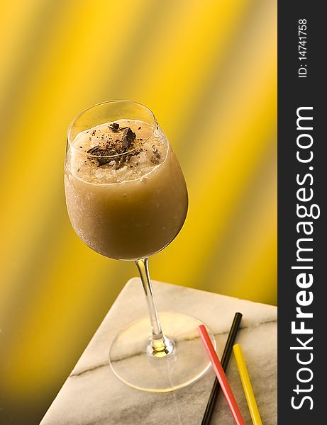 Black Prince cocktail with chocolate flakes and three straws