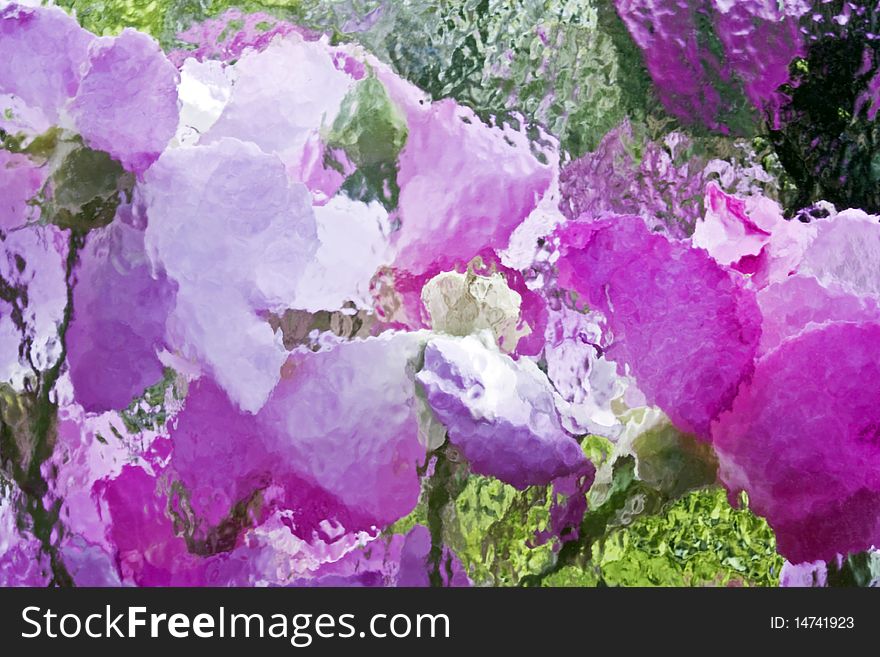 an abstract background of pink flowers behind a textured glass window. an abstract background of pink flowers behind a textured glass window