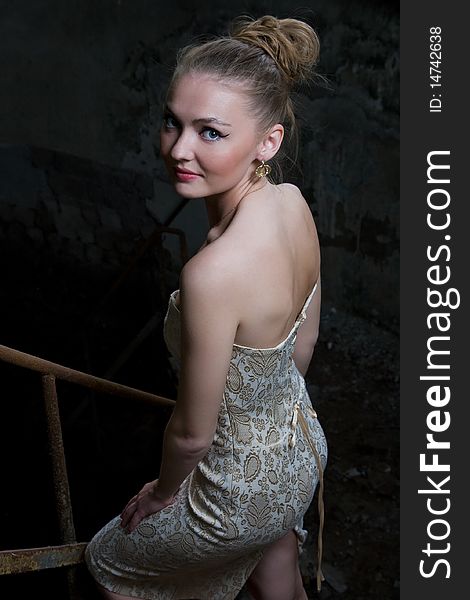 Beautiful young woman posing in the ruins