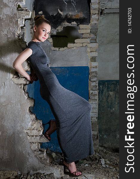 Beautiful young woman posing in the ruins