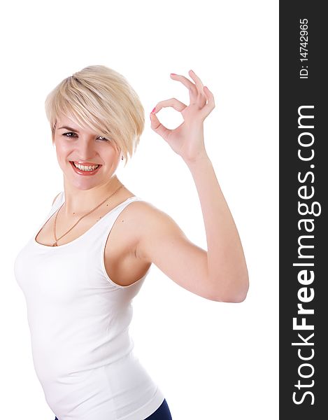 A charming young girl in a white T-shirt makes a sports exercise isolated on white