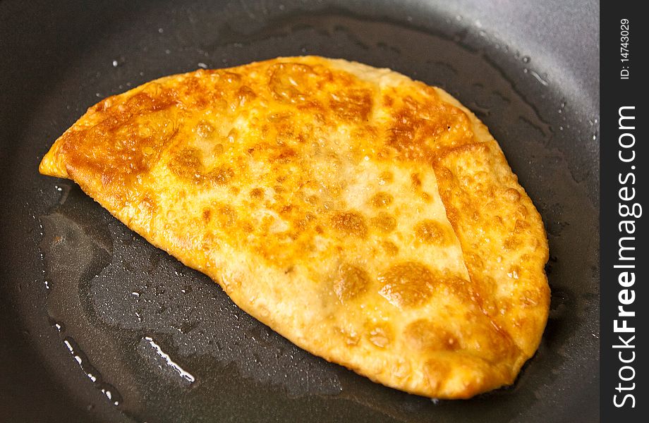 Chebureck - a fried pie with mince from meat of mutton