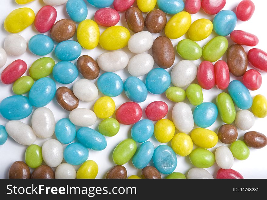 Lots of sweets in different colours on white background. Lots of sweets in different colours on white background
