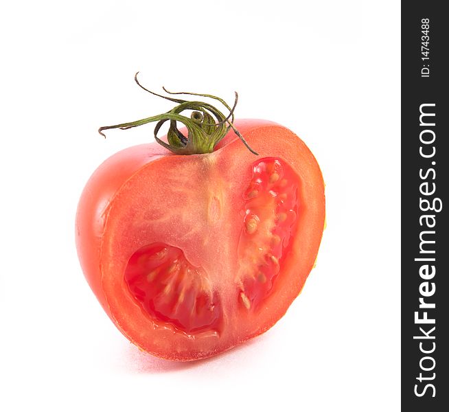 Half-part of isolated tomato over white background