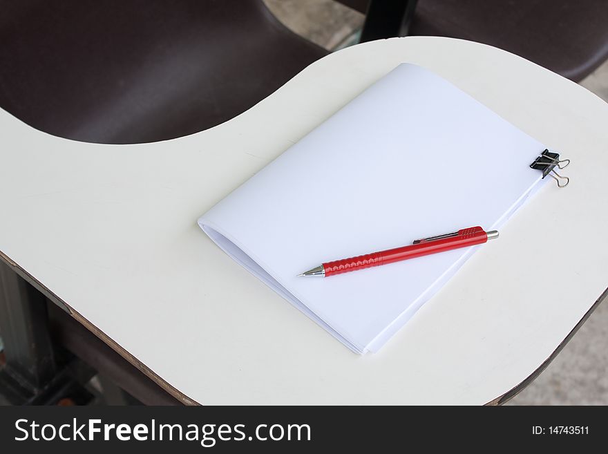 Blank note and the pencil on the desk. Blank note and the pencil on the desk