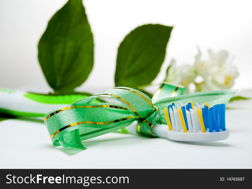 Toothbrush as gift with tied up ribbon. Toothbrush as gift with tied up ribbon
