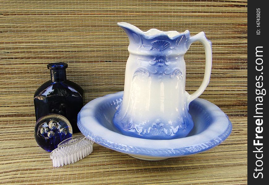 Pitcher and bowl set with bottle, glass,sphere and nail brush