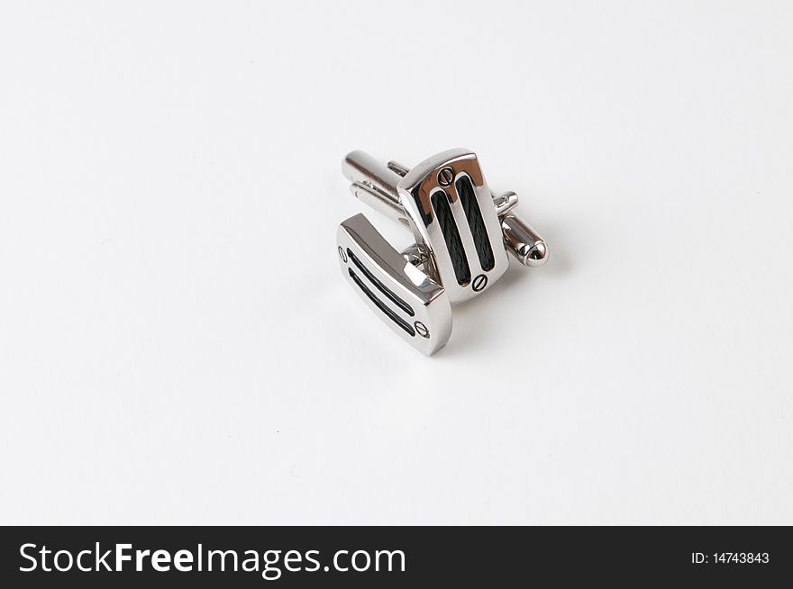 Shirt cuff-links isolated on a white background. Shirt cuff-links isolated on a white background