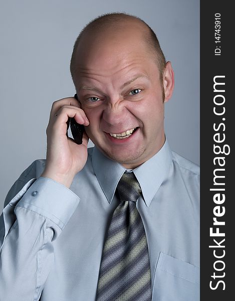 The businessman emotional talking by phone. The businessman emotional talking by phone