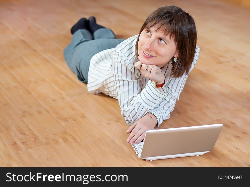 Beautiful Business Woman With A Laptop On Floor