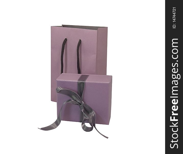 Wrapped present in purple paper with bag.