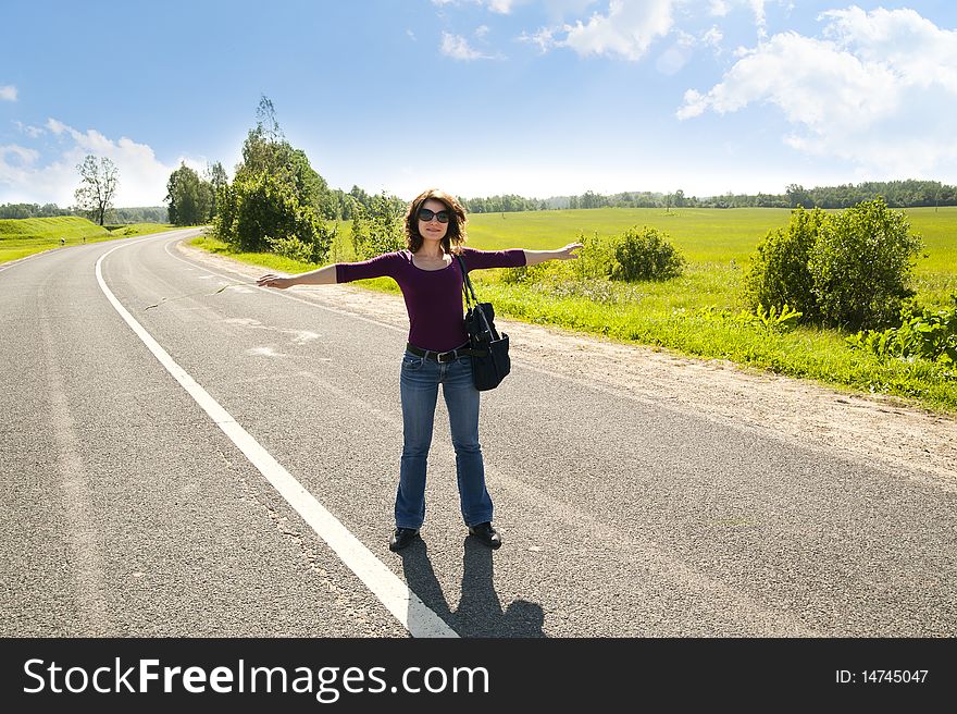 The young girl on automobile highway