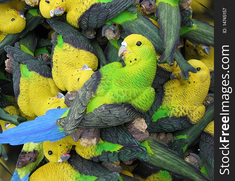many plastic colorful parrot decorations