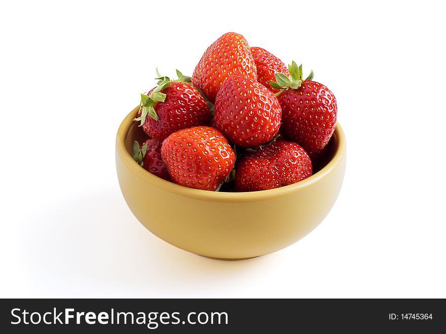 Strawberry on a plate on a white background. Strawberry on a plate on a white background