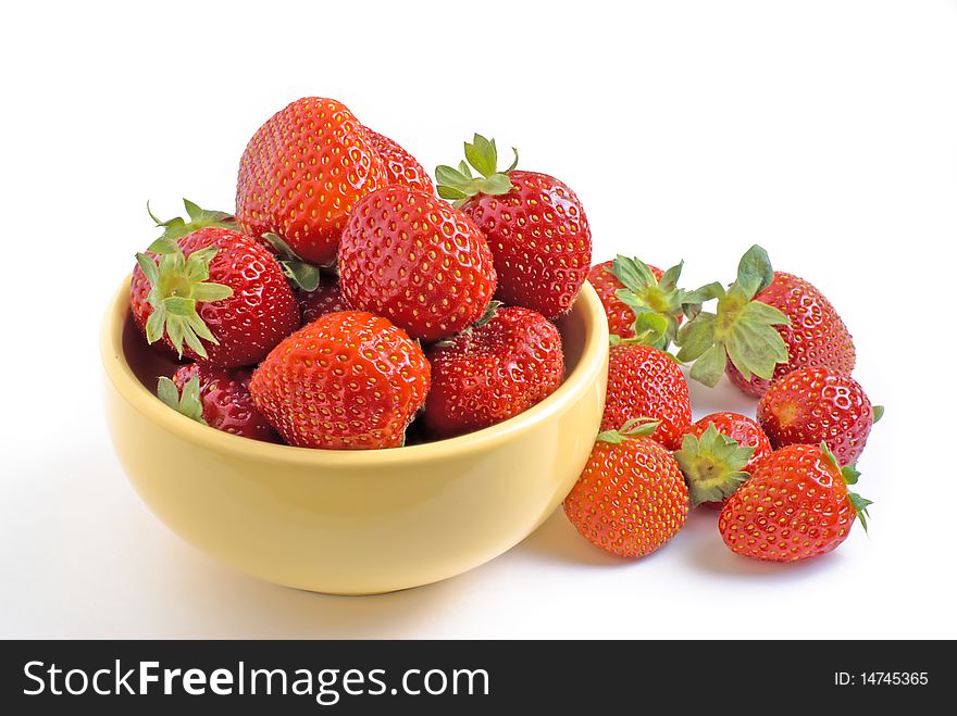 Strawberry on a plate on a white background. Strawberry on a plate on a white background