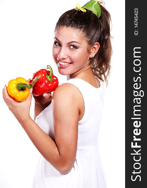Beautiful woman in white dress with fresh paprika. Beautiful woman in white dress with fresh paprika