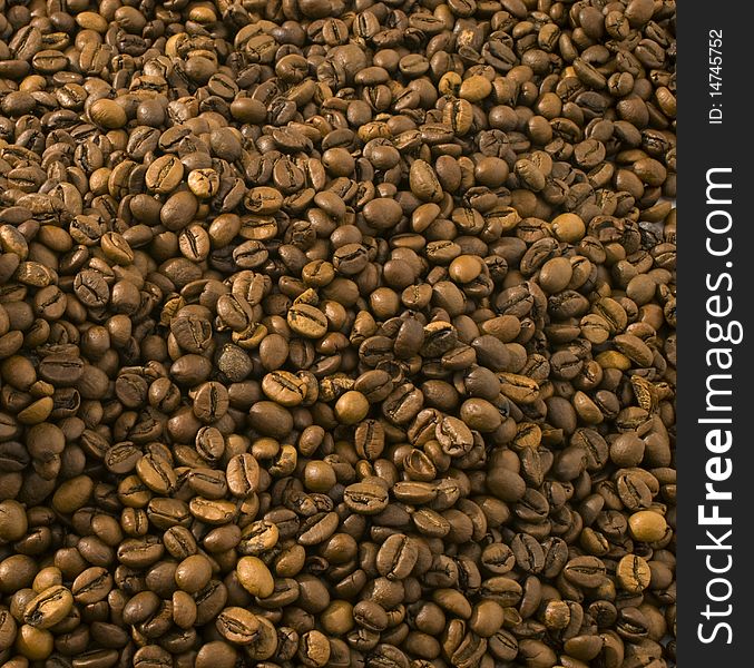 A close-up of many  coffee beans
