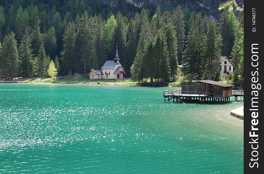 Braies lake in northern italy: church and pier. Braies lake in northern italy: church and pier