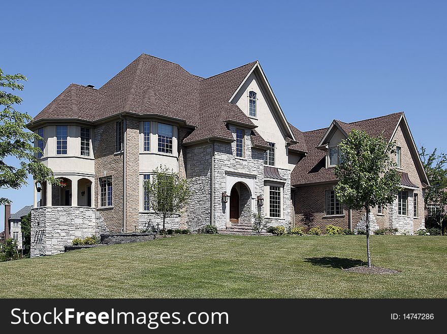 Large home in suburbs with arched entry. Large home in suburbs with arched entry