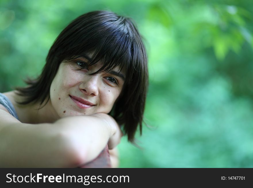 Close-up portrait of young woman smiling and dreaming about someone. Close-up portrait of young woman smiling and dreaming about someone