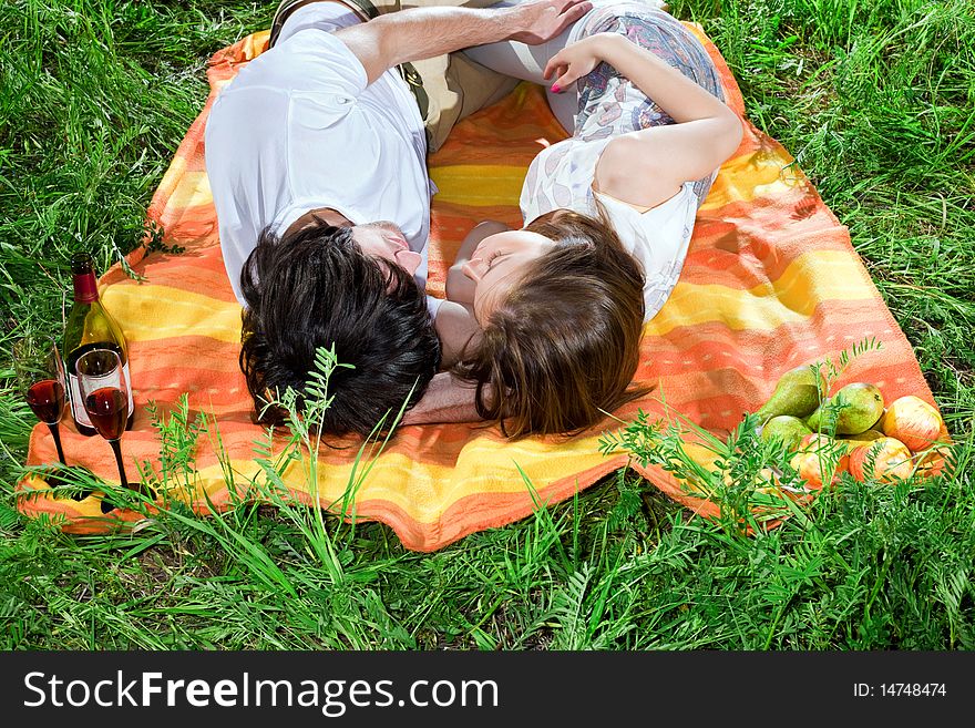 Boy and girl are sleeping on grass