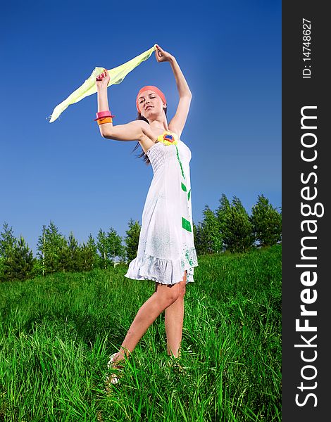 Girl with kerchief on grass