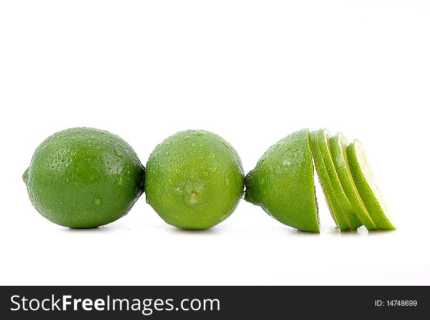 Three fresh limes isolated on white background