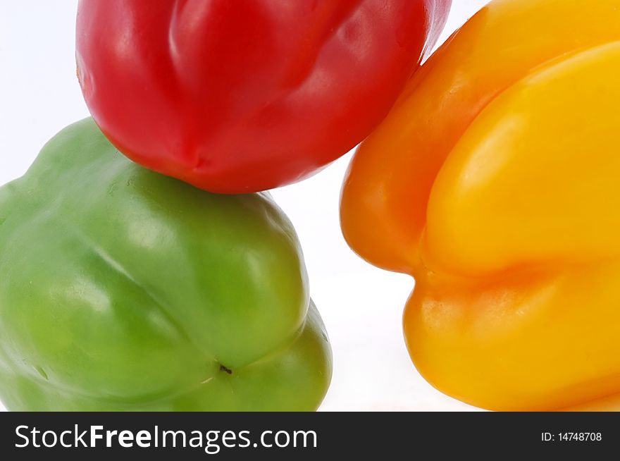 Three sweet color peppers isolated on white background