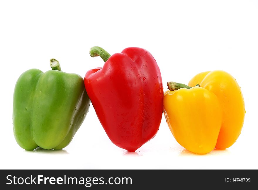 Three sweet color peppers isolated on white background