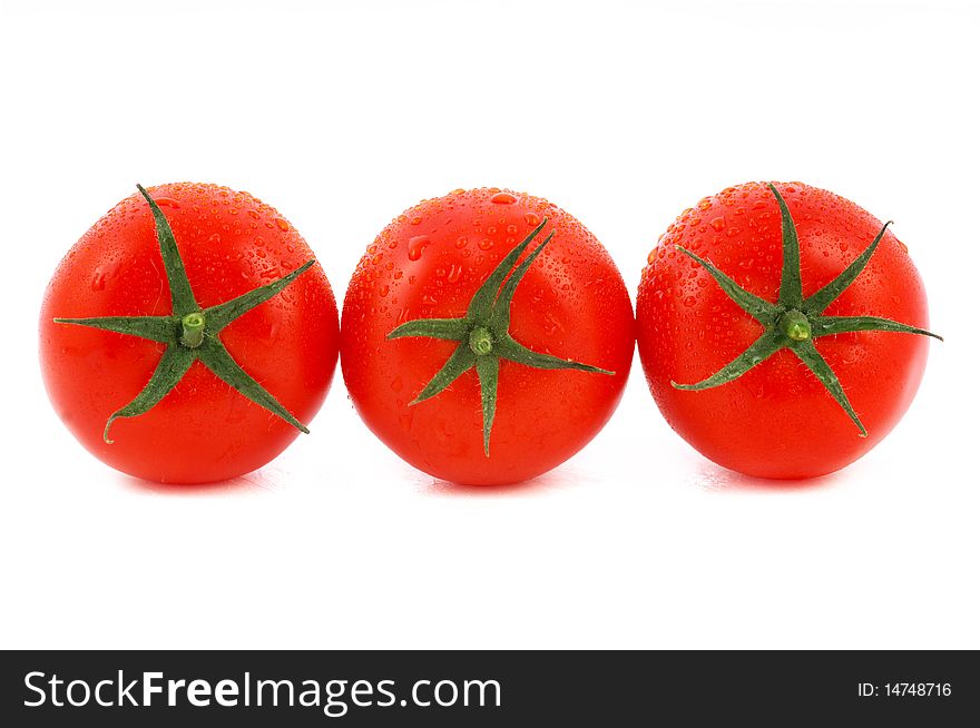Three red tomato isolated on white background