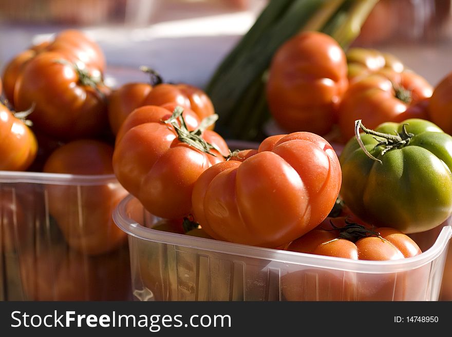 Tomatoes in a plastic basket