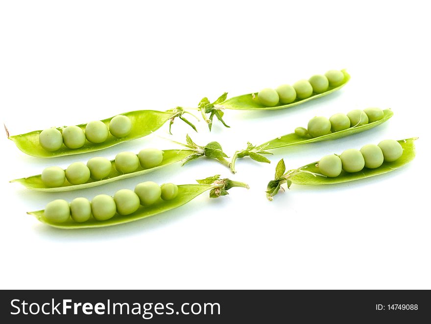 Green peas pods on a white background