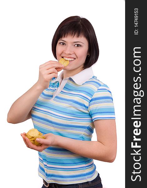 Lovely girl eating potato chips. Eating potato chips / crisps. Cute woman having a junk food snack while looking up at camera. Lovely girl eating potato chips. Eating potato chips / crisps. Cute woman having a junk food snack while looking up at camera