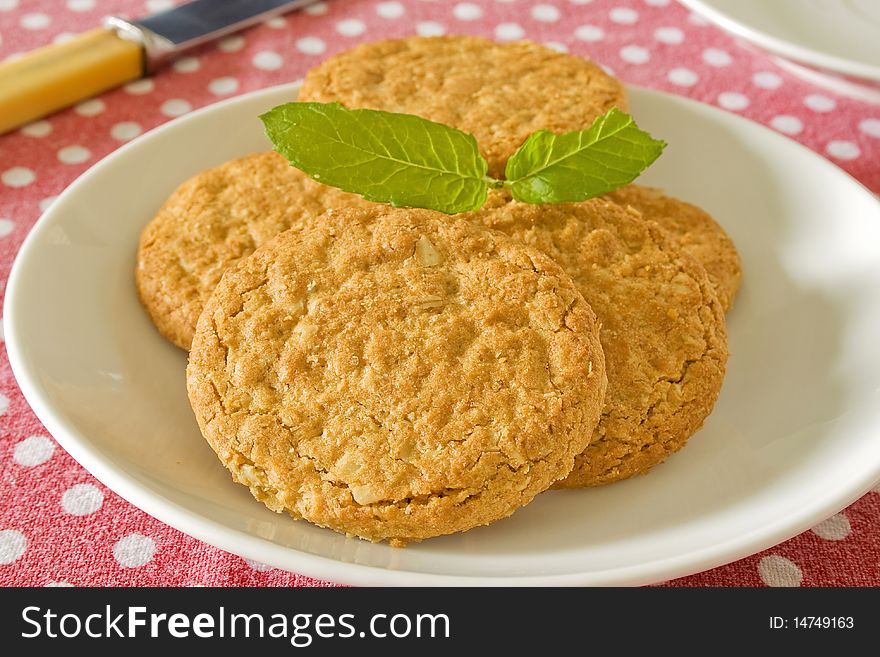 Brown wholemeal biscuits on a white plate