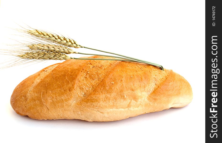Bread with wheat cones on a white background