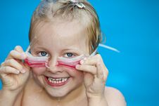 Young Pretty Girl In Swimming-pool Holding Googles Royalty Free Stock Photo