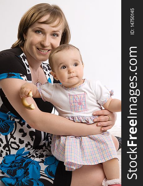 Young woman holding her baby girl. Young woman holding her baby girl