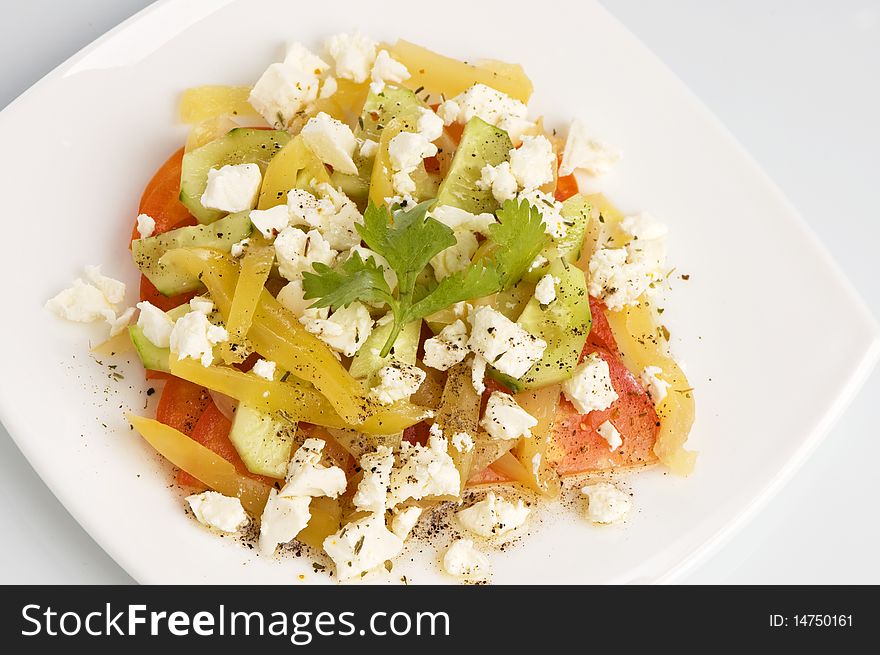 Salad with peppers,  tomatoes and cheese. Salad with peppers,  tomatoes and cheese