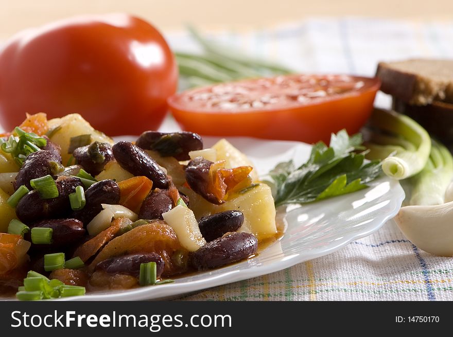 Salad with tomatoes, potatoes and beans, chinese dish. Salad with tomatoes, potatoes and beans, chinese dish