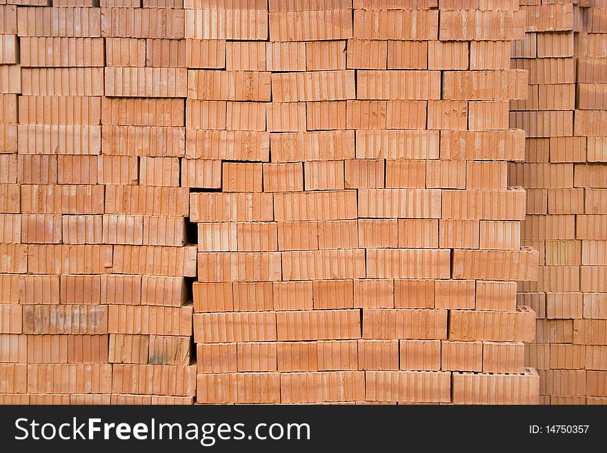 Wall of red bricks material texture background picture