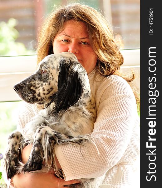 Happy woman with english setter sitting on the porch. Happy woman with english setter sitting on the porch