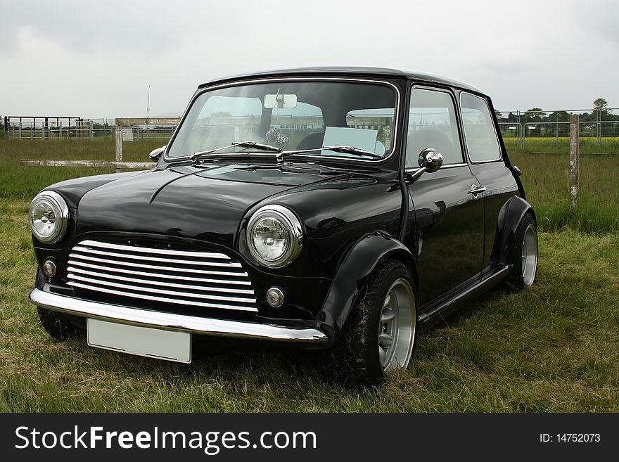 Classic black British car on the grass. Classic black British car on the grass